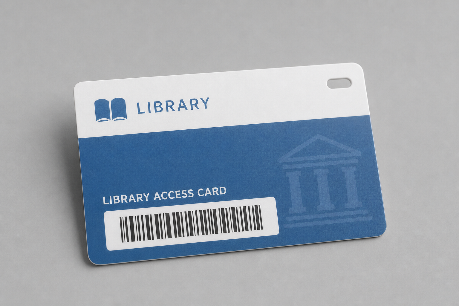 [Composer 2 Prompt]: A realistic plastic library access card with lanyard hole, subtle barcode, no readable personal text, academic institution style.